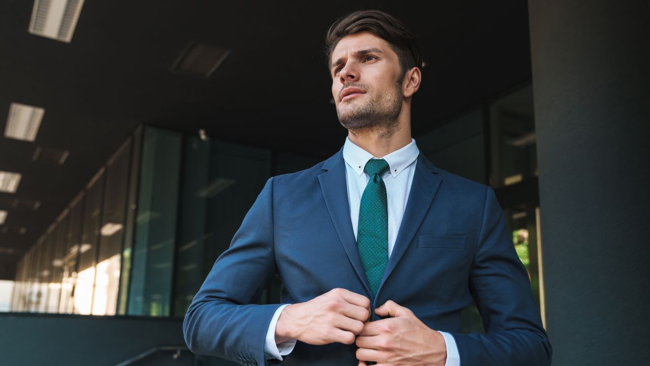 Businessman Buttoning His Suit Jacket